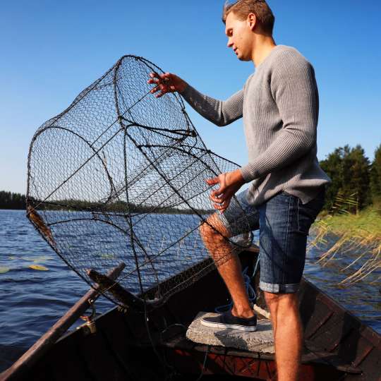 Süßwasserfischen im größten See Finnlands